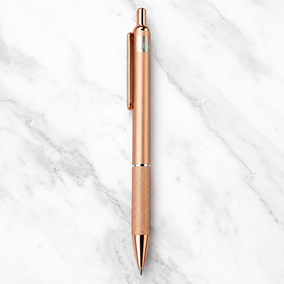 Metallic rose gold click ball pen with rose gold clip and black ink