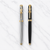 Set of 02 Metallic Glossy Black & Silver Ball Pens with Gold Ashoka Emblem Clip | Openable Cap Mechanism | Blue Ink | 2 Pens + 2 Extra Refills + 1 Surprise Ball Pen