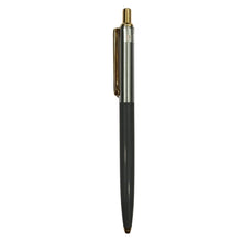 Gunmetal and gold pen with sleek click design for modern and professional writing.