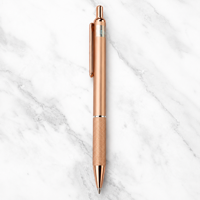 Metallic rose gold click ball pen with rose gold clip and black ink