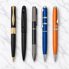 Set of 5 premium metal twist ball pens combo on white marble background
